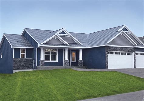 matching metal blue roof and door stone house|house with blue roof.